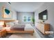 Comfortable bedroom with natural light, neutral walls, and stylish decor, creating a relaxing and inviting atmosphere at 151 Harper Lee St, Davidson, NC 28036