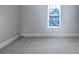 Neutral bedroom featuring wall-to-wall carpeting, and a window at 151 Harper Lee St, Davidson, NC 28036