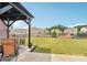 Large backyard with a covered patio and a well-maintained lawn at 15108 Autumn Sage Dr, Charlotte, NC 28278