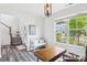 Inviting entryway featuring a white bench and view of the staircase with natural light at 15108 Autumn Sage Dr, Charlotte, NC 28278