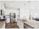 Bright kitchen featuring stainless steel appliances and a granite-topped island at 15108 Autumn Sage Dr, Charlotte, NC 28278