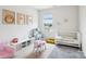 Bright playroom with soft carpet, toys, a mini kitchen, and natural light at 15108 Autumn Sage Dr, Charlotte, NC 28278