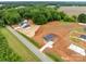 Expansive aerial view featuring a single-story home, lush greenery, and a serene countryside setting at 15700 Stokes Ferry Rd, Richfield, NC 28137