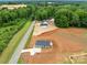 Aerial view showcases the location of a single-story home with surrounding wooded areas at 15700 Stokes Ferry Rd, Richfield, NC 28137