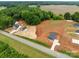 Scenic aerial shot highlighting a single-story house nestled within a tranquil landscape at 15700 Stokes Ferry Rd, Richfield, NC 28137