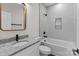 Modern bathroom with granite countertop vanity and subway tile shower and tub at 15700 Stokes Ferry Rd, Richfield, NC 28137