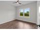 Bedroom featuring a ceiling fan, hardwood floors, and a window with a great view at 15700 Stokes Ferry Rd, Richfield, NC 28137
