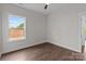 Bright bedroom with hardwood floors and a window with lots of natural light at 15700 Stokes Ferry Rd, Richfield, NC 28137