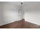 Bedroom with hardwood floors, closet and a door leading to another room at 15700 Stokes Ferry Rd, Richfield, NC 28137