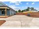 Large concrete driveway and yard offer ample parking space with home partially visible at 15700 Stokes Ferry Rd, Richfield, NC 28137