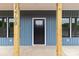 Close-up of a home exterior showing the front door and wooden columns at 15700 Stokes Ferry Rd, Richfield, NC 28137