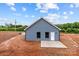 New home with blue siding and concrete pad for outdoor enjoyment, surrounded by a spacious dirt lot at 15700 Stokes Ferry Rd, Richfield, NC 28137