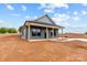 Newly constructed blue home features a front porch, set on a spacious lot awaiting landscaping at 15700 Stokes Ferry Rd, Richfield, NC 28137