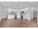 Open-concept kitchen featuring new stainless steel appliances, light blue backsplash and white cabinets at 15700 Stokes Ferry Rd, Richfield, NC 28137