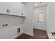 Functional laundry room with upper cabinets and utility connections, offering convenience and storage at 15700 Stokes Ferry Rd, Richfield, NC 28137