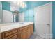Bathroom with double sink vanity, shower, and tile floor at 16919 Hedgerow Park Rd, Charlotte, NC 28277