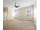 Spacious bedroom with wall-to-wall carpeting, and large windows at 16919 Hedgerow Park Rd, Charlotte, NC 28277