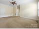 Bedroom with carpeting, ceiling fan, and large window at 16919 Hedgerow Park Rd, Charlotte, NC 28277