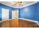 This spacious bedroom has hardwood floors, crown molding, and two closets at 16919 Hedgerow Park Rd, Charlotte, NC 28277