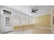 Bright sunroom with multiple windows and tile floors at 16919 Hedgerow Park Rd, Charlotte, NC 28277