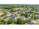 Aerial view of a residential community with lush greenery and a pond at 2006 Holly Villa Cir, Indian Trail, NC 28079