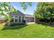 Backyard features a patio, privacy screen, lawn and view of the rear of house at 2006 Holly Villa Cir, Indian Trail, NC 28079