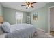 Green bedroom with a sign artwork on the wall, ceiling fan, and carpet floors at 2006 Holly Villa Cir, Indian Trail, NC 28079