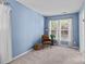 Bright bedroom with natural light, cozy chair, and neutral colored carpet at 2006 Holly Villa Cir, Indian Trail, NC 28079