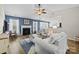 Cozy living room with a fireplace, lots of natural light and ample seating at 2006 Holly Villa Cir, Indian Trail, NC 28079