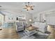 Bright living room with ceiling fan, hardwood floors, and open concept design at 2006 Holly Villa Cir, Indian Trail, NC 28079