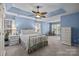 Spacious main bedroom with a tray ceiling, and lots of natural light at 2006 Holly Villa Cir, Indian Trail, NC 28079
