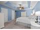 Blue-themed main bedroom with ceiling fan, carpet, and a bright, airy feel at 2006 Holly Villa Cir, Indian Trail, NC 28079