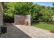 Backyard featuring a stamped concrete patio with privacy screen, seating and a hammock at 2006 Holly Villa Cir, Indian Trail, NC 28079