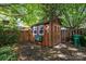 Exterior view of shed with windows, life preserver, and fenced perimeter at 2006 Holly Villa Cir, Indian Trail, NC 28079