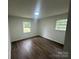 Bedroom featuring a neutral color palette, wood flooring, and bright windows at 201 Harley St, Wadesboro, NC 28170