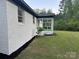 Charming home exterior features a brick facade, screened porch, and well-maintained lawn at 201 Harley St, Wadesboro, NC 28170