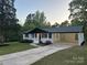 Charming single-story home with landscaped front yard and a convenient carport at 201 Harley St, Wadesboro, NC 28170