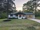 Charming single-story home featuring a well-manicured lawn, complementing shrubs, and brick exterior at 201 Harley St, Wadesboro, NC 28170