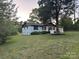 Beautifully landscaped yard showcasing a classic ranch-style home with a clean, modern aesthetic at 201 Harley St, Wadesboro, NC 28170