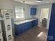 Bright kitchen with updated granite countertops, window view, and painted cabinets at 201 Harley St, Wadesboro, NC 28170