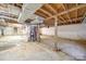 Unfinished basement offering ample space with exposed ceiling, concrete floor, and utility equipment at 20337 Nc Hwy 73 Hwy, Albemarle, NC 28001