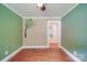 Cozy bedroom featuring hardwood floors, tree decal on the wall, and fresh paint at 20337 Nc Hwy 73 Hwy, Albemarle, NC 28001