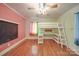 Bright bedroom featuring a modern bunk bed with desk and colorful curtains at 20337 Nc Hwy 73 Hwy, Albemarle, NC 28001
