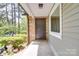Charming front entrance with stone accents, neutral siding, and a welcoming covered porch area at 20337 Nc Hwy 73 Hwy, Albemarle, NC 28001