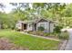 Charming home with a mix of siding and stonework, lush lawn, and mature landscaping at 20337 Nc Hwy 73 Hwy, Albemarle, NC 28001