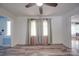 Living room with wood-look flooring and neutral curtains at 20337 Nc Hwy 73 Hwy, Albemarle, NC 28001