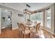 Elegant dining room with hardwood floors, large windows, and a stylish chandelier at 2062 High Pines Rd, Rock Hill, SC 29732