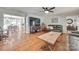 Open living room with hardwood floors, gray couches, and a view of the dining area at 2062 High Pines Rd, Rock Hill, SC 29732