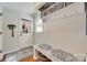 Inviting mudroom with a bench, coat hooks, and storage shelves for organization at 2062 High Pines Rd, Rock Hill, SC 29732