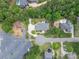 An aerial view showcases the property's lush landscaping and proximity to boat storage and other waterfront properties at 216 Commodore Ct, Belmont, NC 28012